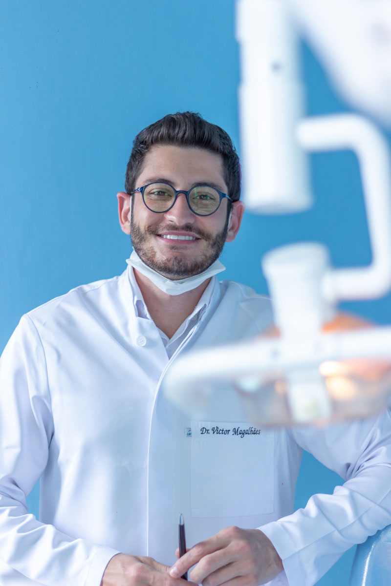 Dentist using magnifying loupes during a procedure