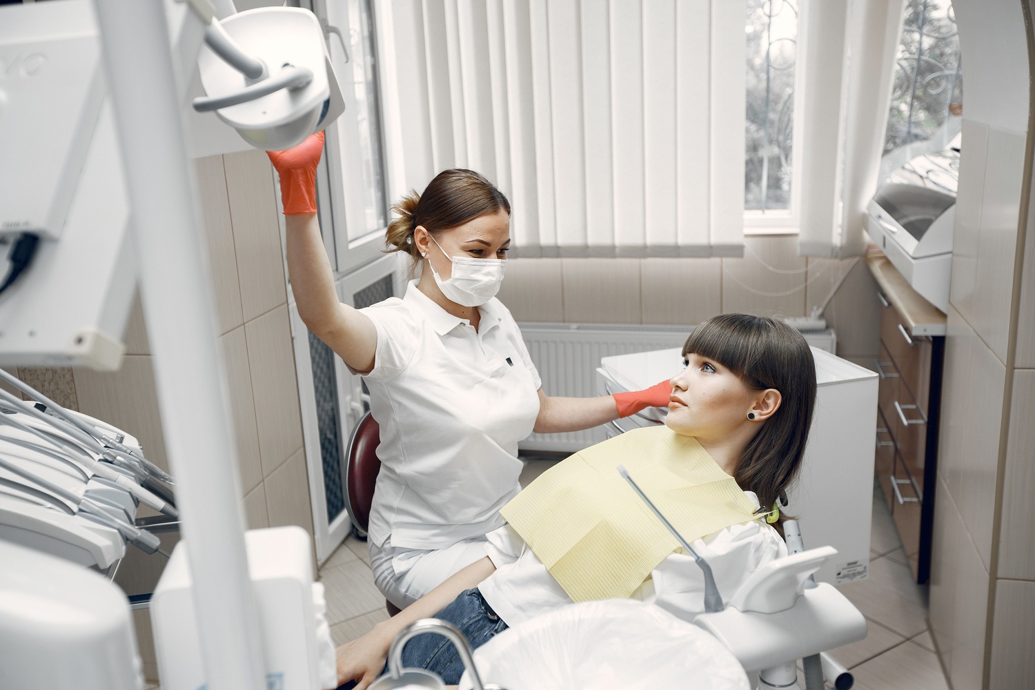 A patient with a bright, confident, perfectly white smile