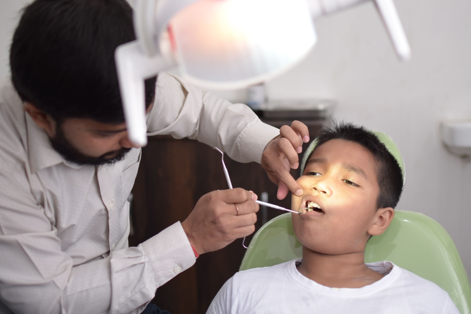 Modern, immaculate dental treatment room with precision equipment